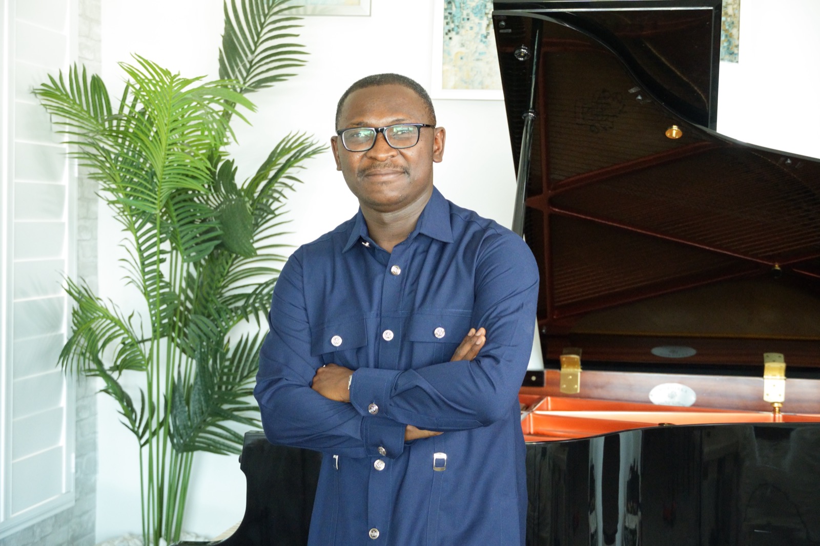 Dr. Nathanael Adjei at the piano